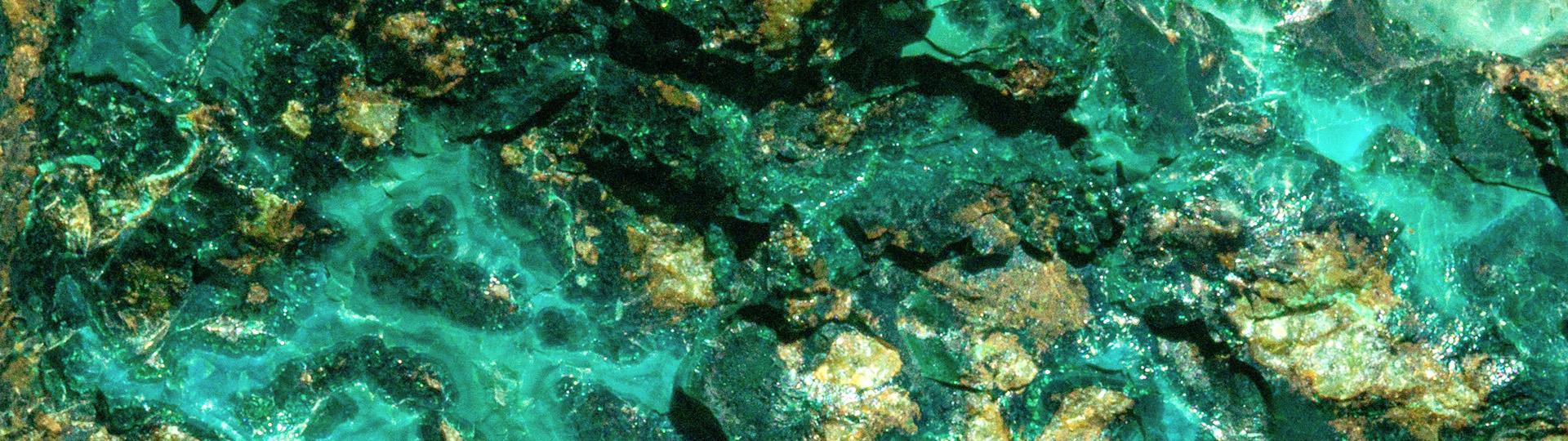 Closeup view of green mineral crystals.